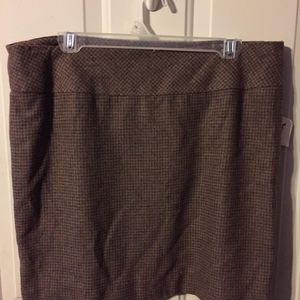 The limited short lined brown plaid skirt. Size 12